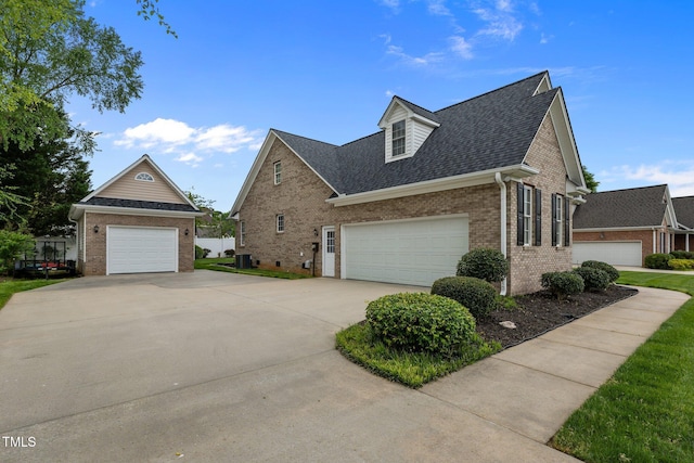 view of front facade featuring brick siding, driveway, and a shingled roof