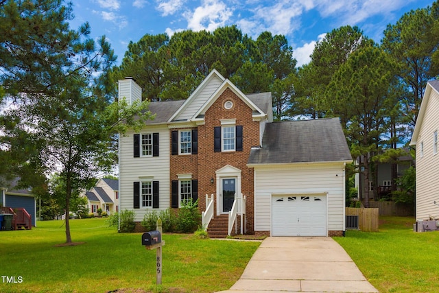 805 Penncross Dr, Raleigh, NC 27610 - view of front of property featuring a chimney, an attached garage, driveway, and a front lawn