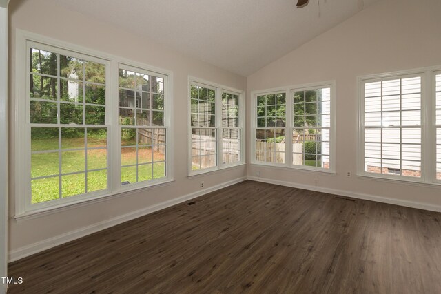 805 Penncross Dr, Raleigh, NC 27610 - unfurnished sunroom with baseboards, lofted ceiling, and wood finished floors