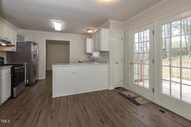 805 Penncross Dr, Raleigh, NC 27610 - kitchen with electric range, under cabinet range hood, a sink, dark wood finished floors, and white cabinets