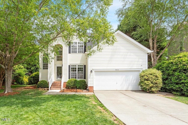 traditional home with concrete driveway and a front lawn