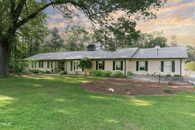 11 Pine Forest Dr, Siler City, NC 27344 - single story home with a chimney, brick siding, and a lawn