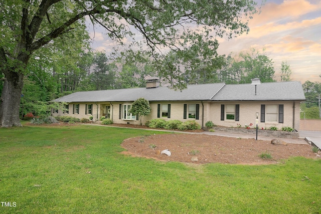 11 Pine Forest Dr, Siler City, NC 27344 - single story home with a chimney, brick siding, and a front yard