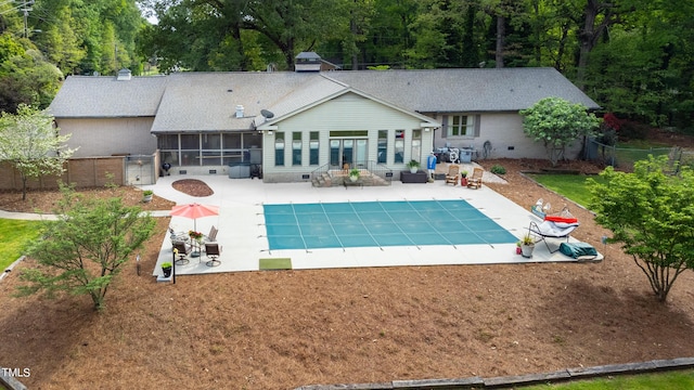11 Pine Forest Dr, Siler City, NC 27344 - back of property featuring a fenced backyard, a fenced in pool, a sunroom, and a patio