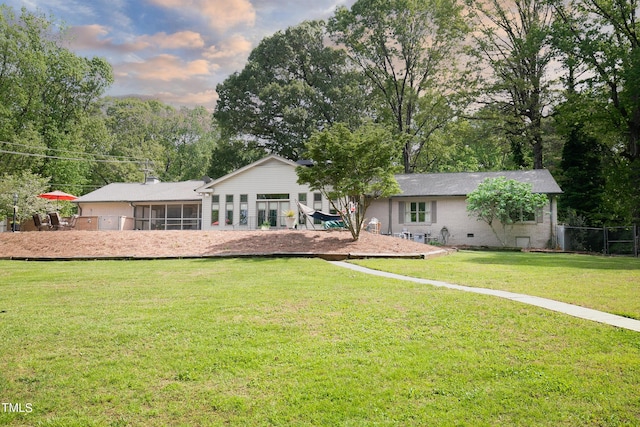 11 Pine Forest Dr, Siler City, NC 27344 - back of property with fence, a sunroom, and a yard