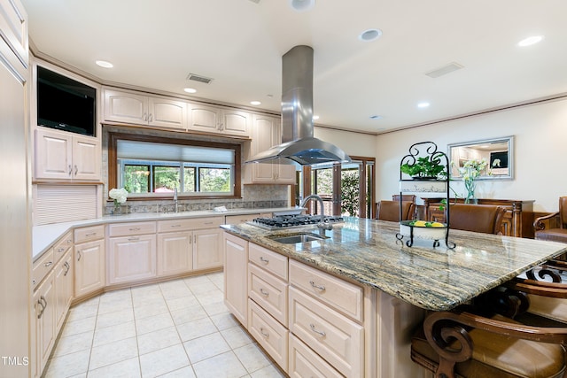 11 Pine Forest Dr, Siler City, NC 27344 - kitchen with visible vents, a breakfast bar, island exhaust hood, and light stone counters