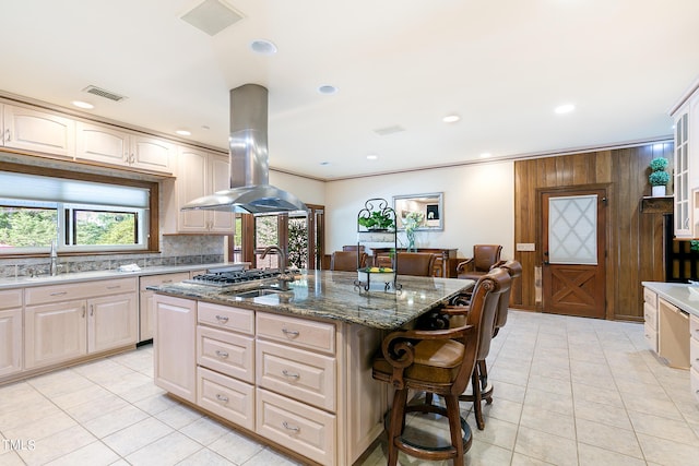 11 Pine Forest Dr, Siler City, NC 27344 - kitchen featuring visible vents, island range hood, light tile patterned floors, a sink, and dark stone counters