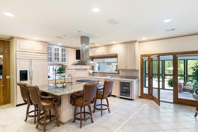 11 Pine Forest Dr, Siler City, NC 27344 - kitchen with paneled built in refrigerator, island range hood, light tile patterned floors, visible vents, and wine cooler
