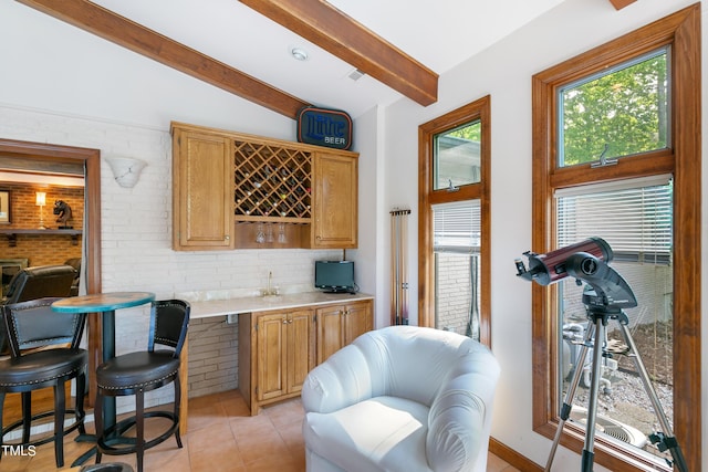 11 Pine Forest Dr, Siler City, NC 27344 - bar featuring wet bar, tasteful backsplash, lofted ceiling with beams, and light tile patterned floors