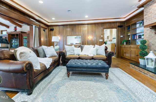 11 Pine Forest Dr, Siler City, NC 27344 - living room with wood finished floors, wood walls, and ornamental molding