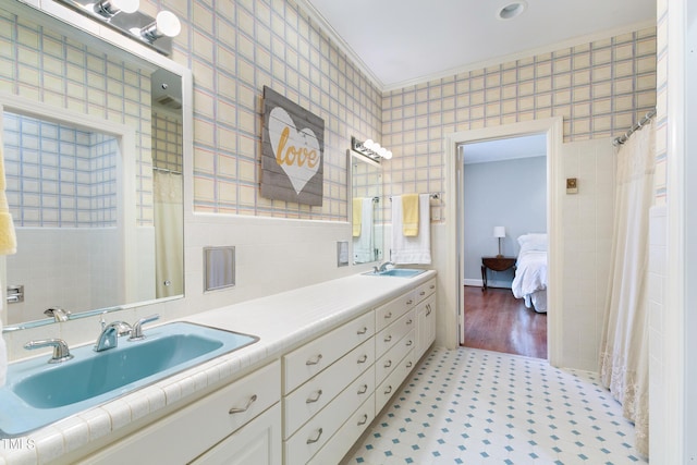 11 Pine Forest Dr, Siler City, NC 27344 - bathroom featuring tile patterned floors, a sink, double vanity, and tile walls