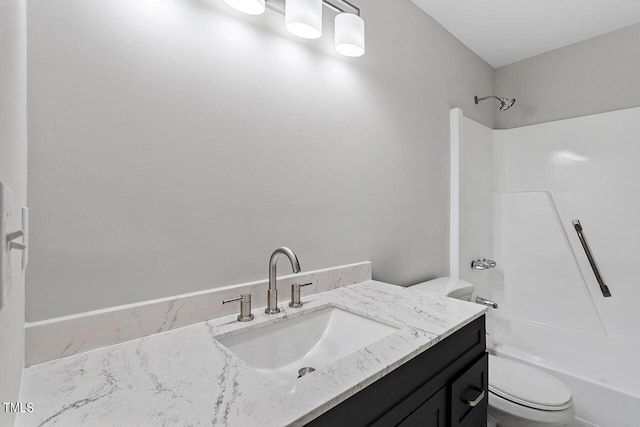 full bath with vanity, toilet, and shower / washtub combination