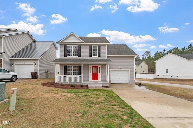 traditional home with a garage, driveway, a porch, and a front yard