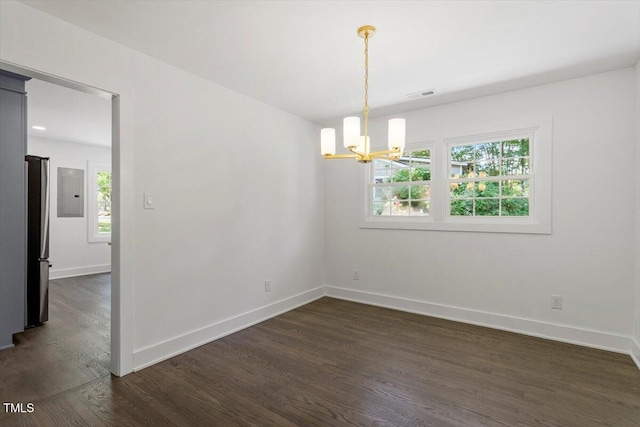 unfurnished room with baseboards, electric panel, dark wood-type flooring, and a notable chandelier