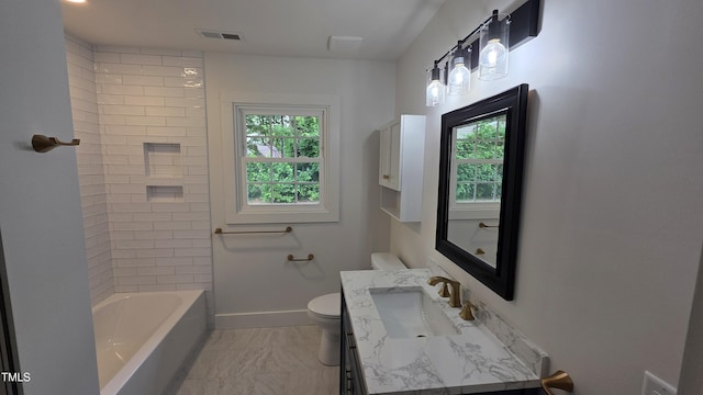1314 Hudson Ave, Durham, NC 27705 - full bath with vanity, toilet, marble finish flooring, baseboards, and tub / shower combination
