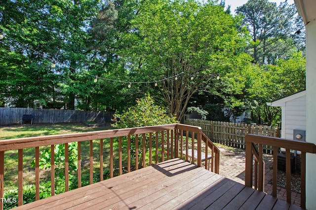 deck featuring a fenced backyard and a yard