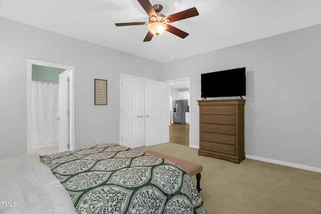 1305 Montreux Ct, Mebane, NC 27302 - bedroom with connected bathroom, light colored carpet, ceiling fan, baseboards, and stainless steel refrigerator with ice dispenser