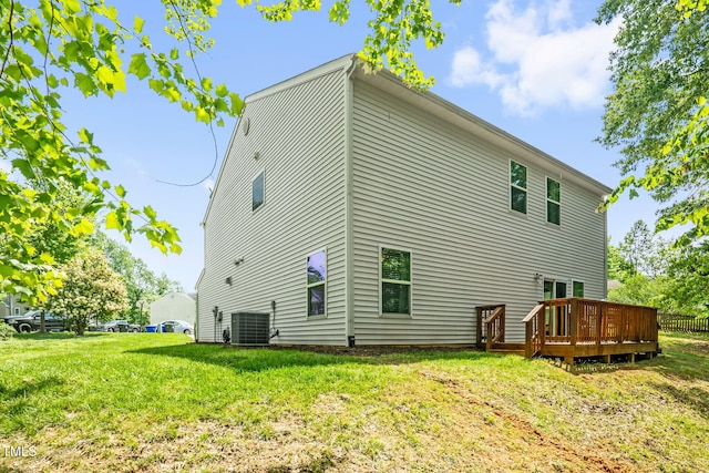 1305 Montreux Ct, Mebane, NC 27302 - back of property featuring central AC, a deck, and a lawn