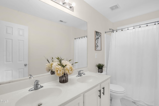 1305 Montreux Ct, Mebane, NC 27302 - full bathroom with toilet, double vanity, a sink, and visible vents