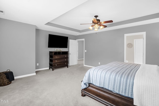 1305 Montreux Ct, Mebane, NC 27302 - carpeted bedroom with a ceiling fan, a raised ceiling, and baseboards