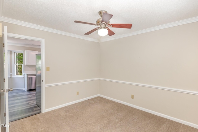 spare room featuring crown molding, a ceiling fan, a textured ceiling, and carpet