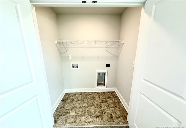 laundry area with baseboards, hookup for a washing machine, and laundry area