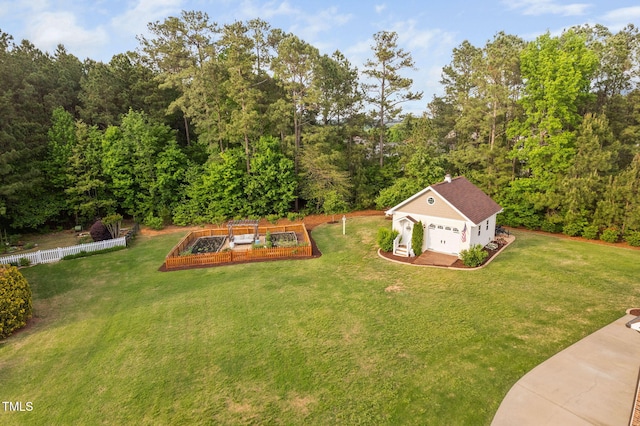 48 Falling Oak Ct, Clayton, NC 27520 - view of yard featuring a garden, an outdoor structure, and a forest view