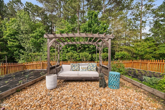 48 Falling Oak Ct, Clayton, NC 27520 - fenced backyard with a pergola, an outdoor living space, a garden, and view of wooded area