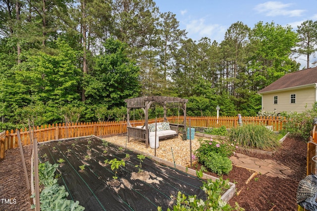 48 Falling Oak Ct, Clayton, NC 27520 - deck with a garden, a pergola, a fenced backyard, and view of wooded area