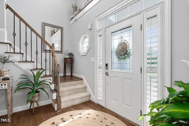 48 Falling Oak Ct, Clayton, NC 27520 - foyer entrance featuring wood finished floors, stairway, and baseboards