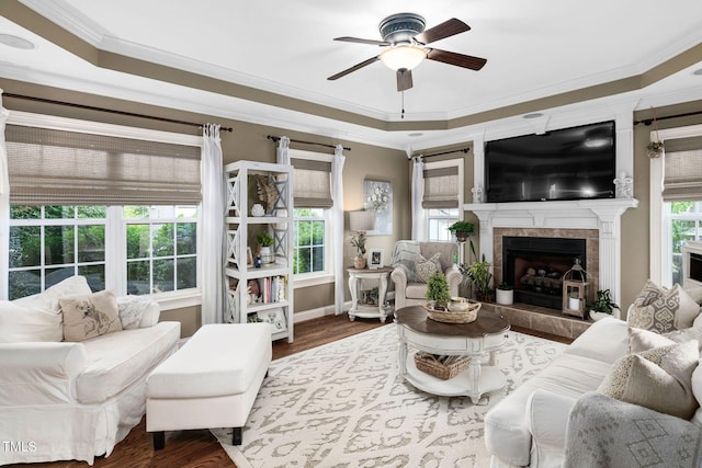 48 Falling Oak Ct, Clayton, NC 27520 - living area with a ceiling fan, ornamental molding, wood finished floors, a tile fireplace, and baseboards