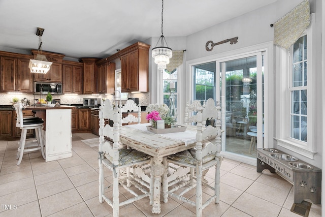 48 Falling Oak Ct, Clayton, NC 27520 - dining area with light tile patterned floors and a chandelier