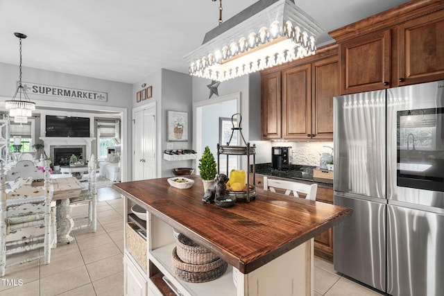 48 Falling Oak Ct, Clayton, NC 27520 - kitchen featuring smart refrigerator, wood counters, light tile patterned floors, and decorative backsplash