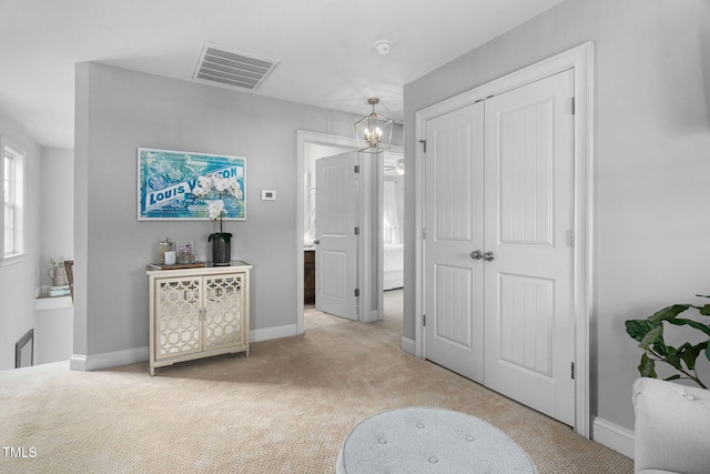 48 Falling Oak Ct, Clayton, NC 27520 - bedroom featuring light colored carpet, a closet, a chandelier, and baseboards