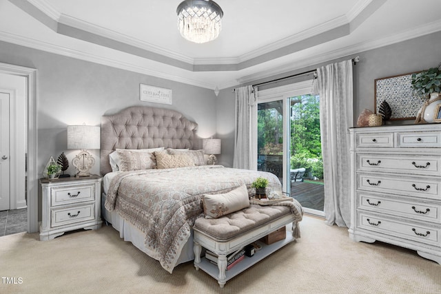 48 Falling Oak Ct, Clayton, NC 27520 - bedroom featuring a tray ceiling, access to outside, light carpet, a chandelier, and crown molding