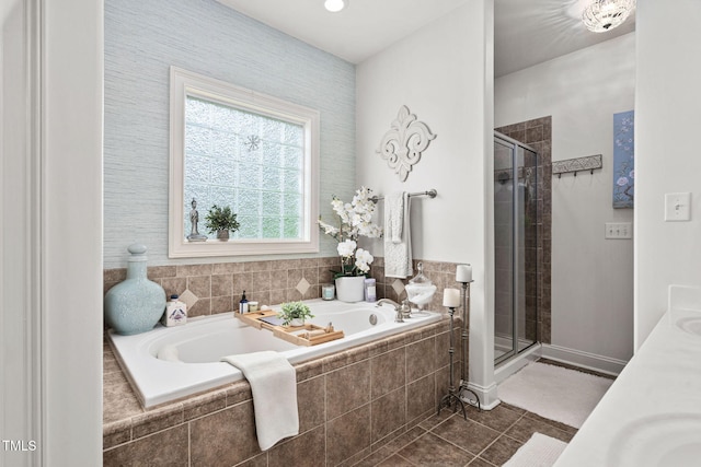 48 Falling Oak Ct, Clayton, NC 27520 - bathroom with a stall shower, a bath, tile patterned flooring, and double vanity