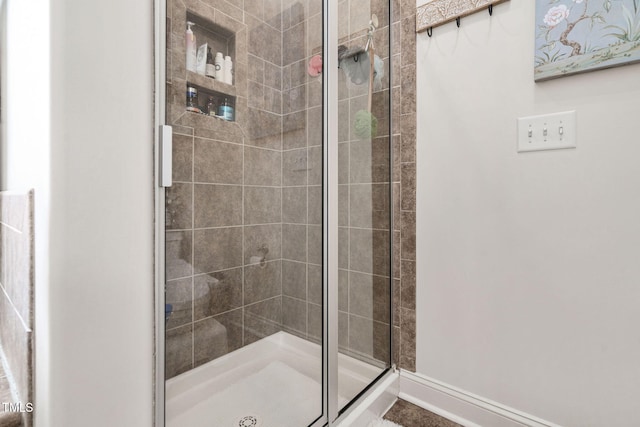 48 Falling Oak Ct, Clayton, NC 27520 - bathroom with a stall shower and baseboards