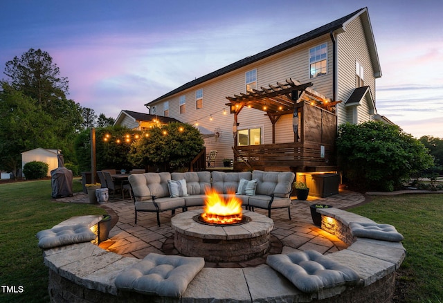 48 Falling Oak Ct, Clayton, NC 27520 - patio terrace at dusk with a patio area, a pergola, a lawn, and an outdoor living space with a fire pit