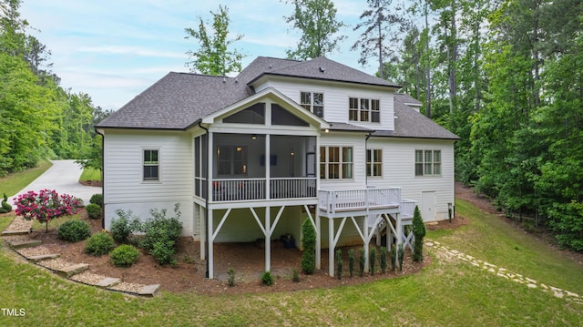197 Boxwood Dr, Pittsboro, NC 27312 - rear view of house featuring a sunroom, a shingled roof, and a lawn
