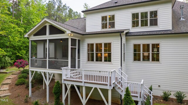 197 Boxwood Dr, Pittsboro, NC 27312 - back of house with a shingled roof, a sunroom, and a wooden deck