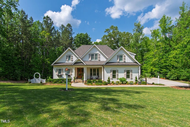 197 Boxwood Dr, Pittsboro, NC 27312 - craftsman inspired home with a front lawn, a porch, board and batten siding, and roof with shingles