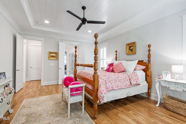 197 Boxwood Dr, Pittsboro, NC 27312 - bedroom with light wood finished floors, baseboards, wood ceiling, a tray ceiling, and ceiling fan