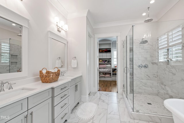 197 Boxwood Dr, Pittsboro, NC 27312 - full bathroom featuring a stall shower, marble look tiles, double vanity, recessed lighting, and a spacious closet