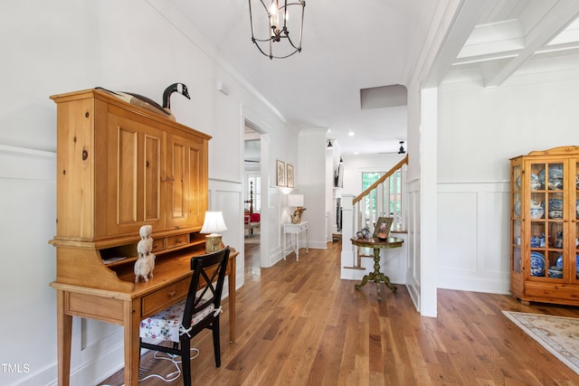 197 Boxwood Dr, Pittsboro, NC 27312 - foyer entrance with a decorative wall, crown molding, stairs, light wood-style flooring, and a chandelier