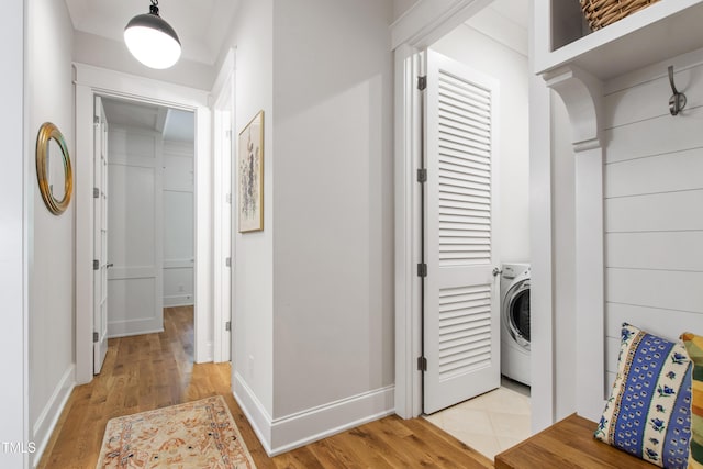 197 Boxwood Dr, Pittsboro, NC 27312 - washroom with washer / clothes dryer, light wood finished floors, and baseboards