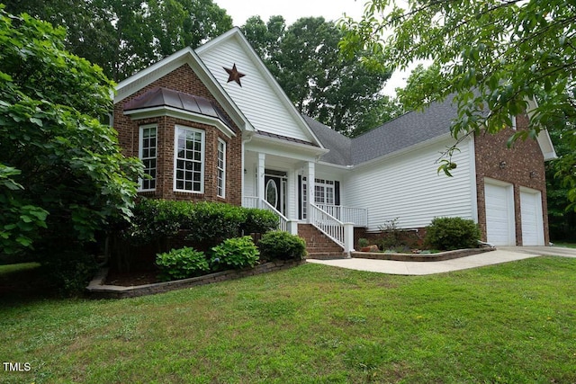 view of front of home with brick siding, a front lawn, driveway, and an attached garage
