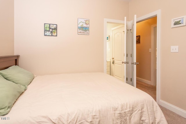 bedroom featuring carpet flooring and baseboards