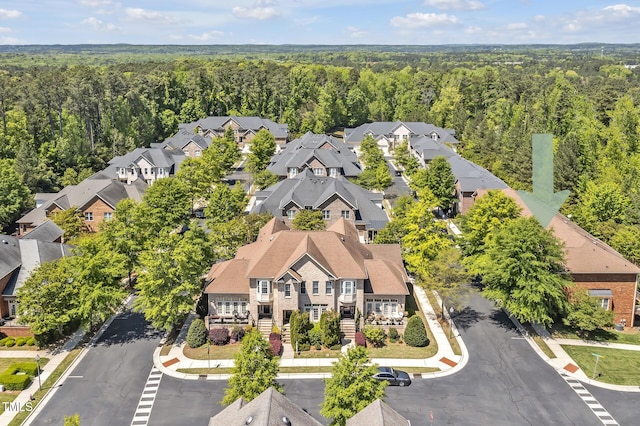 aerial view featuring a residential view and a forest view