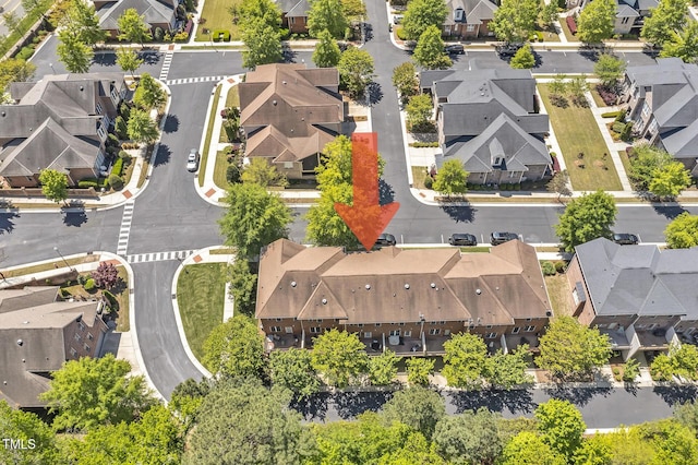 birds eye view of property with a residential view