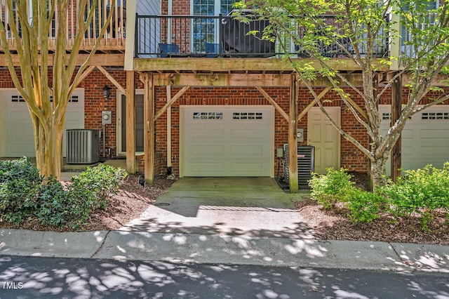 exterior space with driveway and central air condition unit